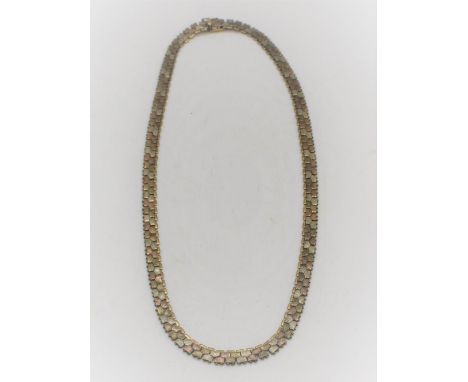 9ct three tone night and day gold articulated necklace, engine turned white, yellow and rose gold interlinked panels with bea