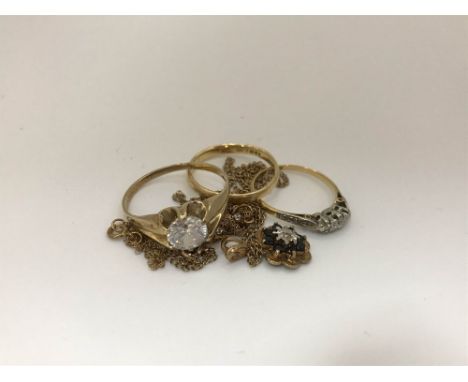 Two 18ct gold rings, total weight 4.9g, a 9ct gold cross and chain, a sapphire and diamond 9ct gold pendant and chain and a r