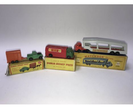 Boxed Dublo Dinky 73 'Land Rover and horse trailer' (with horse), a 70 'AEC Mercury tanker Shell BP' (with windows), and a Ma