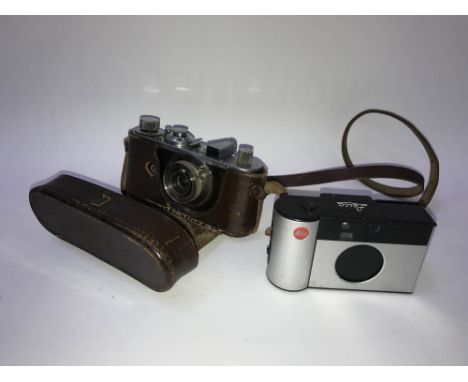 A Leica camera and case, number 241701 and a Leica automatic camera