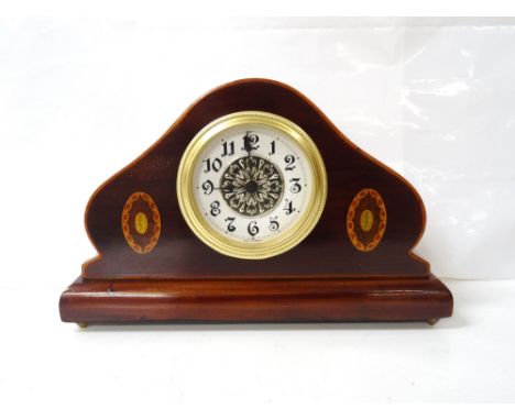 INLAID WALNUT MANTEL CLOCK
with shaped case and German movement, raised on small brass feet, 16cm high x 25cm wide