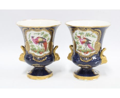 A pair of campana vases,  blue scale ground with exotic bird panels, each with a Worcester style square  backstamp, 15cm (2) 