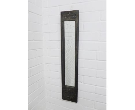 An art nouveau style pewter framed wall mirror, 81 x 16cm. 