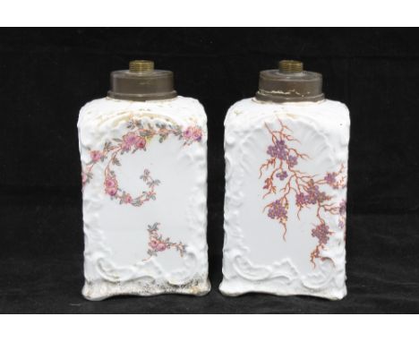 A pair of early 20th century porcelain table lamp bases, white glazed with purple blossoms pattern, 15cm (2) 