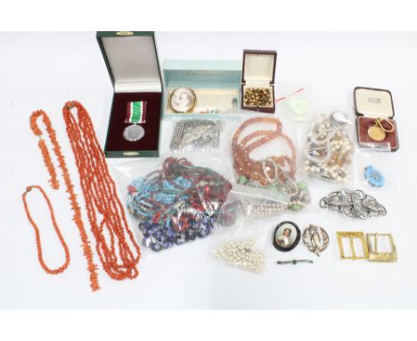 Quantity of vintage costume jewellery contained within a brown leather suitcase to include coral beads, faux pearl necklaces,