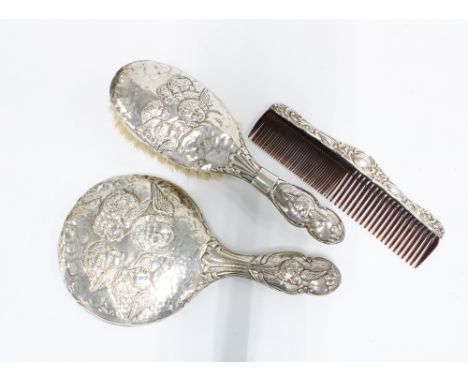 Edwardian silver backed dressing table brush set, Birmingham 1907, comprising a hand mirror, hair brush and comb (3) 