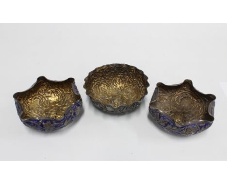 A pair of Eastern white metal and blue enamel dishes together with another of similar design, (3) 