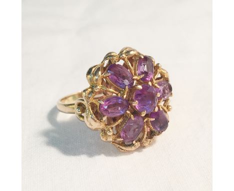 A 9ct gold dress ring set amethysts, size L