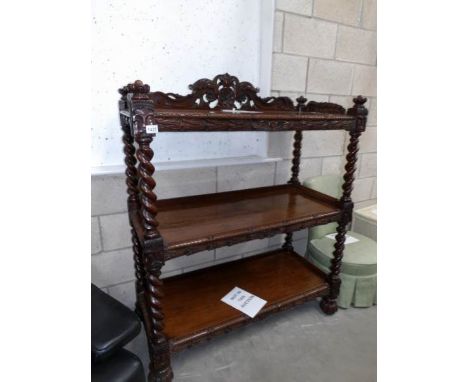 A carved oak 3 tier buffet