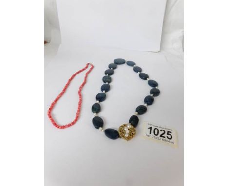 A good 'Blue John' stone necklace with 14kt gold and pearl set clasp together with a coral necklace