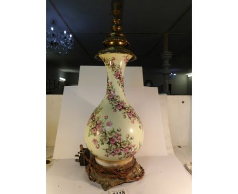 A 1930's porcelain and gilt metal table lamp