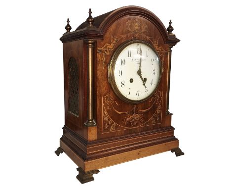 A mahogany inlaid mantel clock, dial inscribed S. Smith & Son Ltd., 104, Strand, London. Mechanism marked 'Rack French make 1