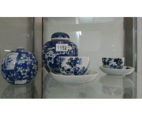 2 Oriental blue and white tea cups and saucers together with a ginger jar and a small vase