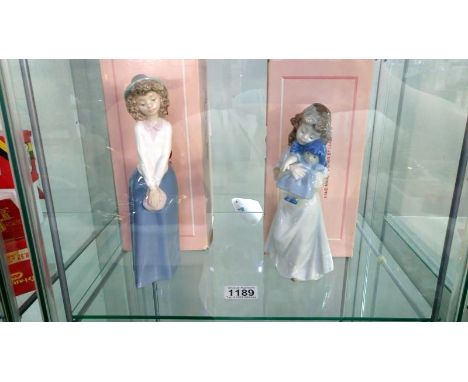 2 boxed NAO figurines