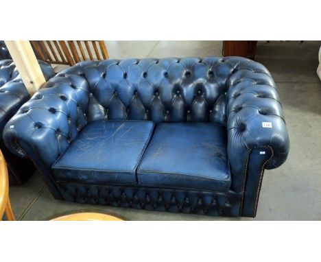 A blue leather 2 seater Chesterfield sofa