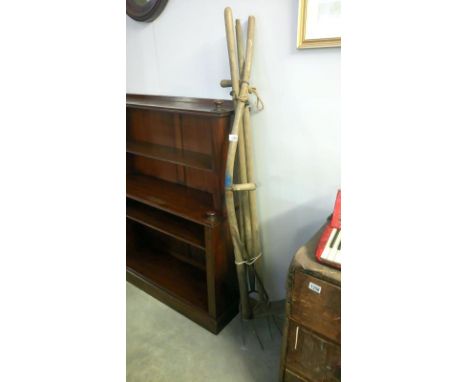 A scythe and other garden tools