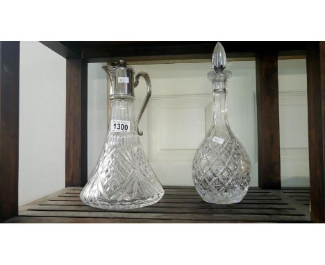 A cut glass decanter and claret jug