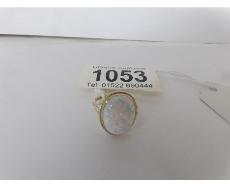 A 9ct gold ring set large oval opal, size M