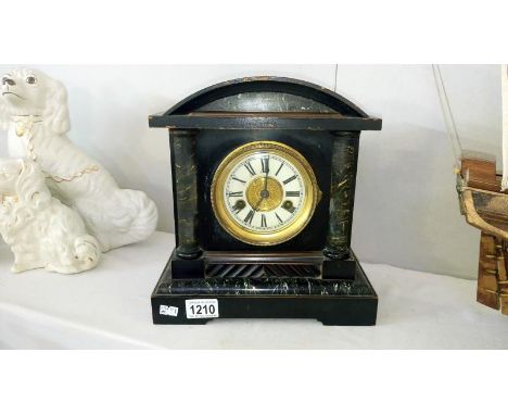 A wooden palladian style mantel clock