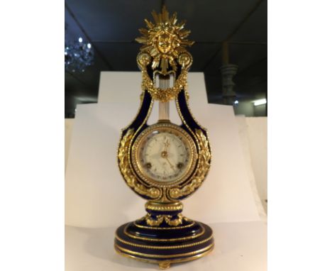A Victorian and Albert museum reproduction Marie Antionette porcelain clock in the Sevres style