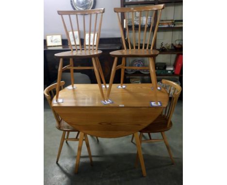 An Ercol table and 4 chairs