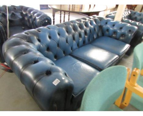 A blue leather 3 seater Chesterfield sofa