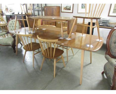 An Ercol extending dining table and 6 chairs