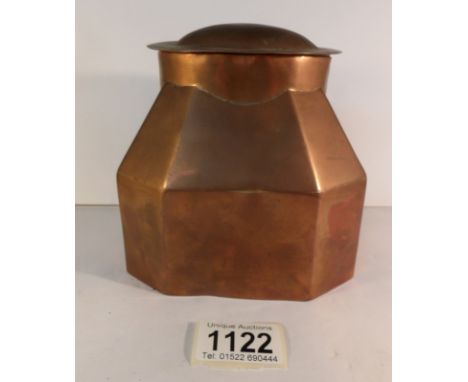 An arts and crafts copper tea caddy with tin lining