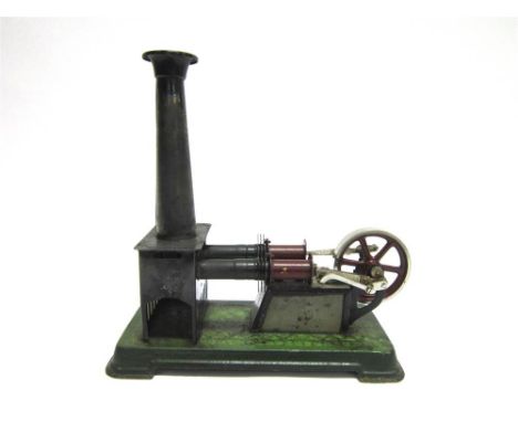A BING TINPLATE STATIONARY HOT AIR ENGINE circa 1925, with two cylinders, a flywheel, and a detachable chimney, good conditio