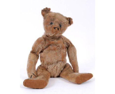 AN EARLY STEIFF PALE GOLD MOHAIR TEDDY BEAR circa 1910, with boot button eyes and the remains of a horizontally stitched nose