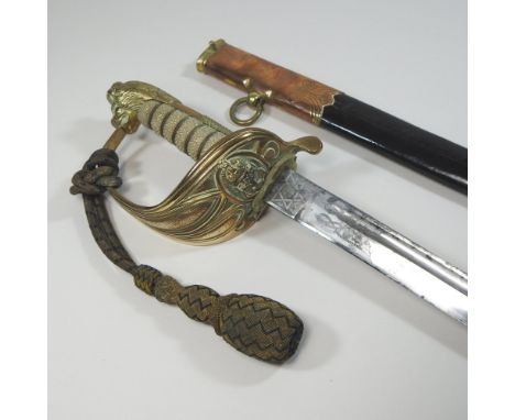 An early 20th century Royal Navy Reserves officer's sword, having a wire bound fish skin grip with lion head pommel and hilt 