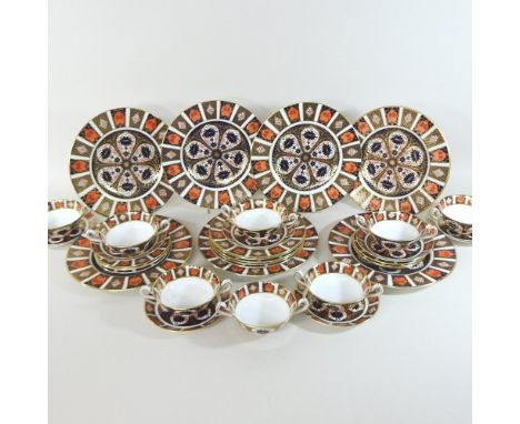 A Crown Derby Imari 1128 pattern part dinner service, comprising seven dinner plates, 27cm diameter, five side plates, 21cm d