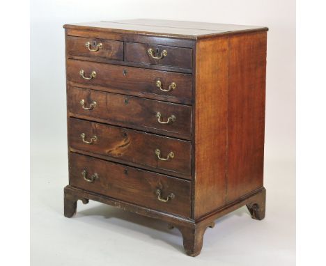 An unusual George III oak architect's chest, containing an arrangement of two short over four long graduated deep drawers, on