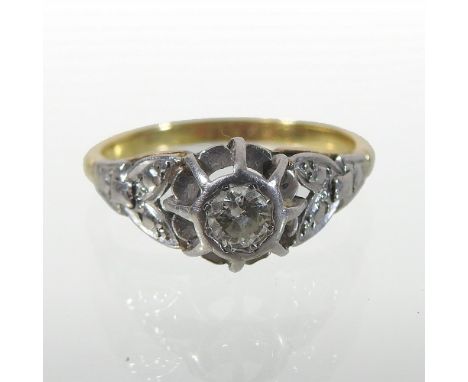 An 18 carat gold and platinum illusion set diamond ring, boxed