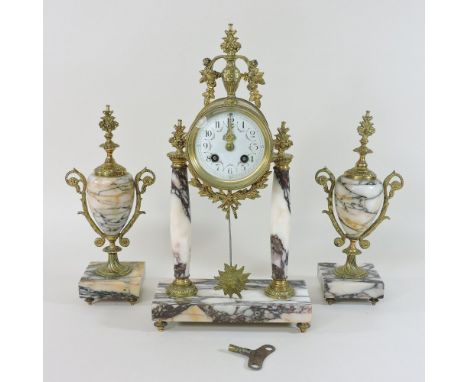 An early 20th century French marble and gilt metal three piece clock garniture, having a painted dial and twin train movement