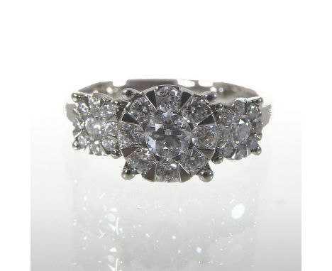 An 18 carat white gold diamond triple cluster ring