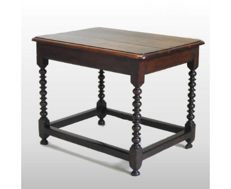 A Charles II style oak side table, on bobbin turned legs, 100cm