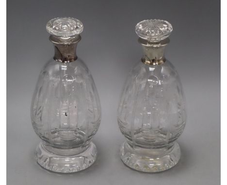 A pair of silver mounted decanters
