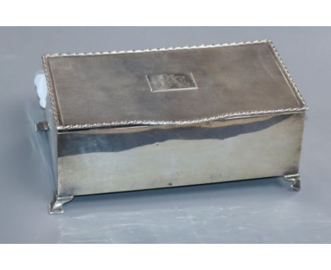 A 1930's silver cigarette box, with engine turned lid, 17.3cm.