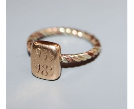 A mid 20th century yellow metal ring, with ropetwist shank, size M.