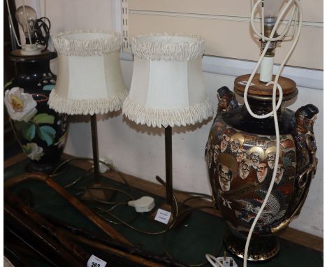 Two ceramic table lamps and shades and a pair of lamps