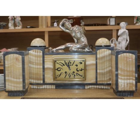 An Art Deco grey and cream marble clock garniture, with figural surmount height 34.5cm