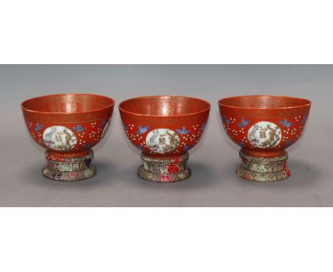 A set of three Chinese coral ground bowls, Republic period Provenance - The owner and her family lived in Singapore in the la