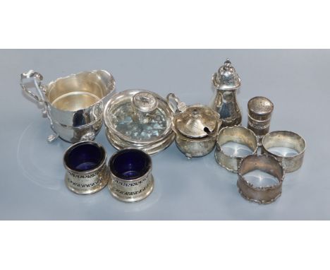 Mixed small silver including a cream jug, Edwardian miniature saucepan pepperette, five condiments, three napkin rings and th