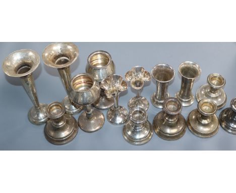 Four assorted pairs of silver posy vases including early 20th century and three pairs of silver dwarf candlesticks.
