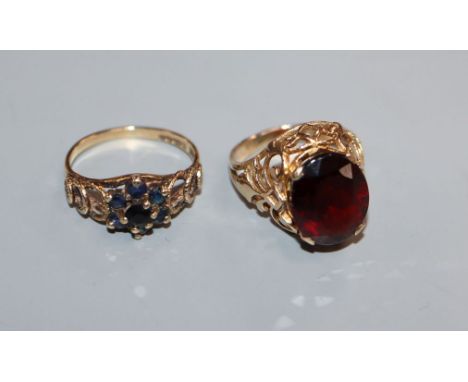 A 9ct and oval garnet set ring and one other 9ct gem set ring.
