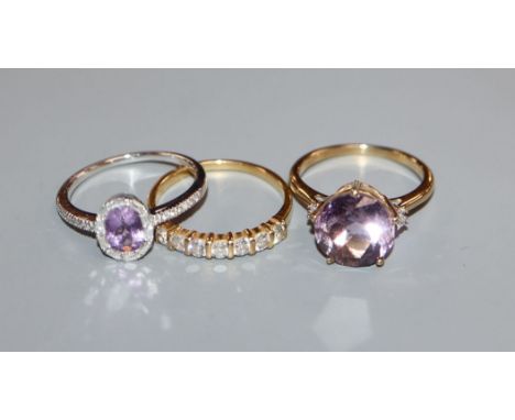 An 18ct gold 7-stone diamond ring, an 18ct white gold, amethyst and diamond ring and a 9ct gold pale amethyst dress ring (3)