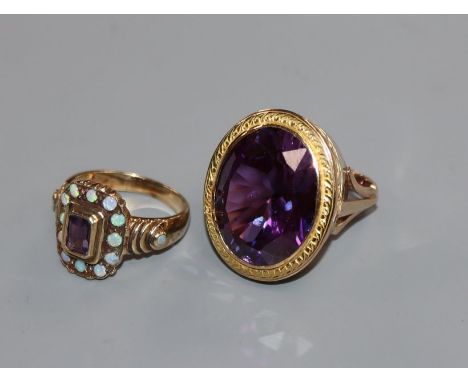 A 375 yellow metal, white opal and amethyst ring and a yellow metal and gem set ring.