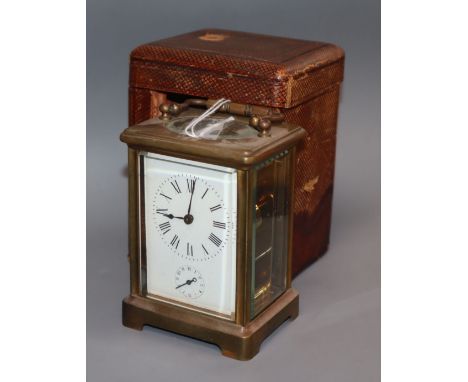 A cased brass carriage clock