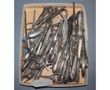 A large quantity of mainly silver handled nail implements.